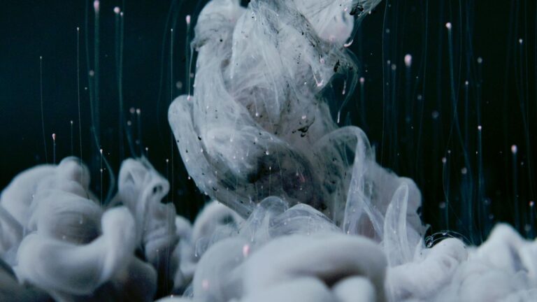 A captivating swirl of ink underwater showcasing abstract fluid dynamics and texture.